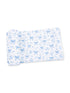 Blue and white patterned fabric featuring bows and flowers laid flat.