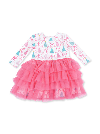 Pink ruffled dress with white top featuring colorful tree and ribbon pattern, ideal for festive occasions.
