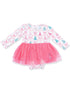 Pink tulle dress with long sleeves and a pattern of bows and trees, suitable for toddlers.