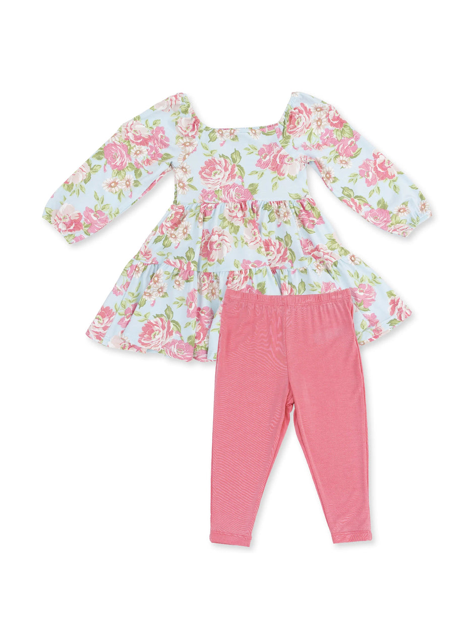 Floral dress with pink leggings, ideal for casual wear. Features long sleeves and a gathered skirt.