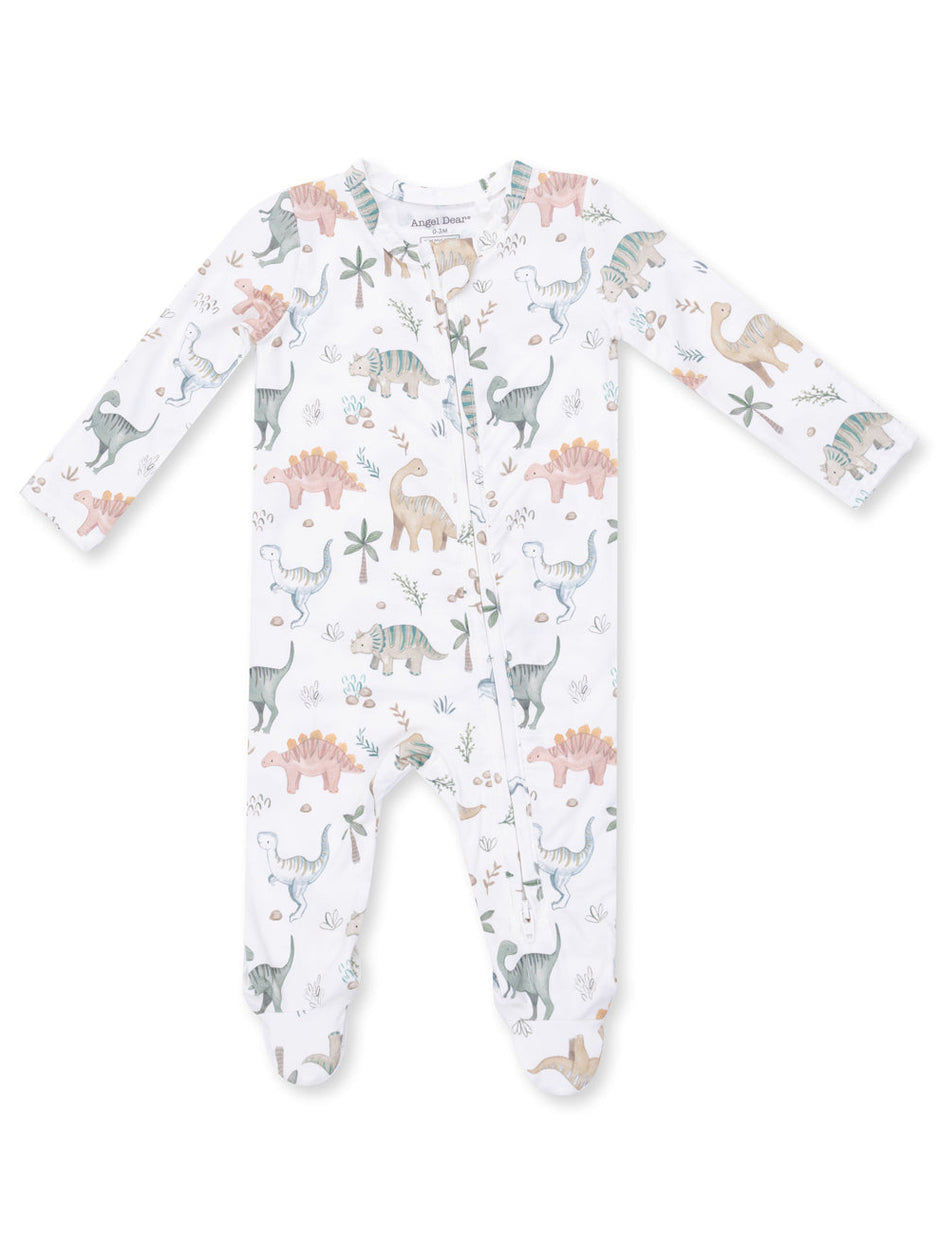 White baby onesie with colorful dinosaur and plant patterns, featuring long sleeves and a front zipper.