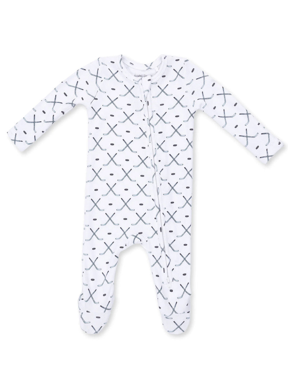 White baby onesie with a black and blue cross pattern, featuring long sleeves and a front zipper.