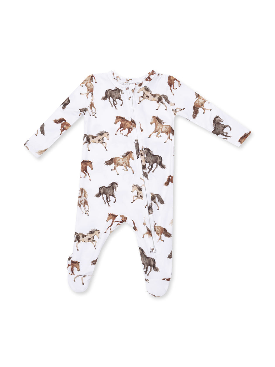 White baby sleeper with playful horse prints in various colors. Zipper closure and long sleeves.