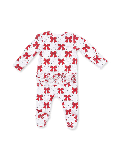 Red bow print footed pajamas with ruffles and polka dots on a white background.