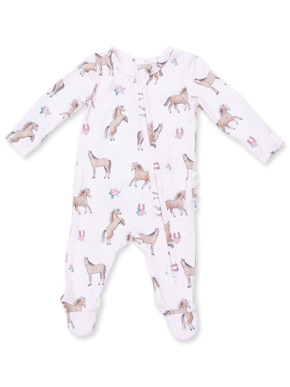 White baby onesie with horse prints and floral accents, featuring long sleeves and footed design.
