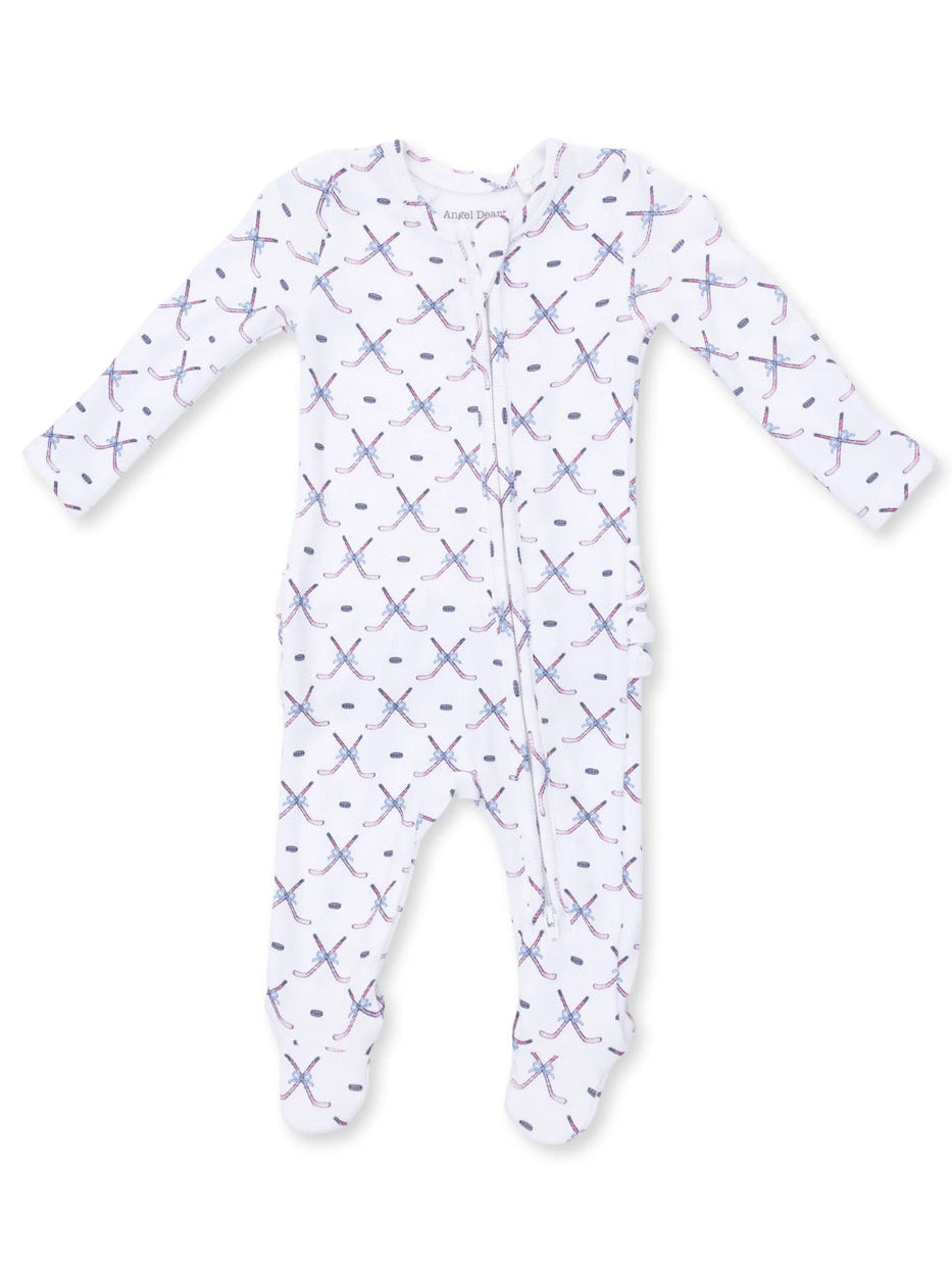 White baby onesie with colorful cross patterns and long sleeves, featuring a front zipper for easy dressing.