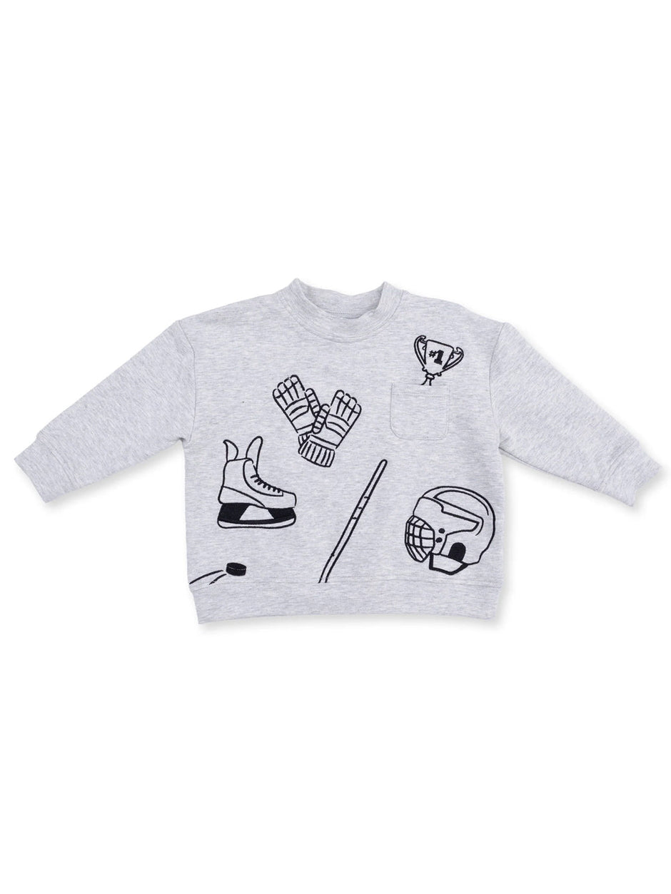 Gray sweatshirt featuring sports-themed graphics like a trophy, ice skates, and hockey gloves.