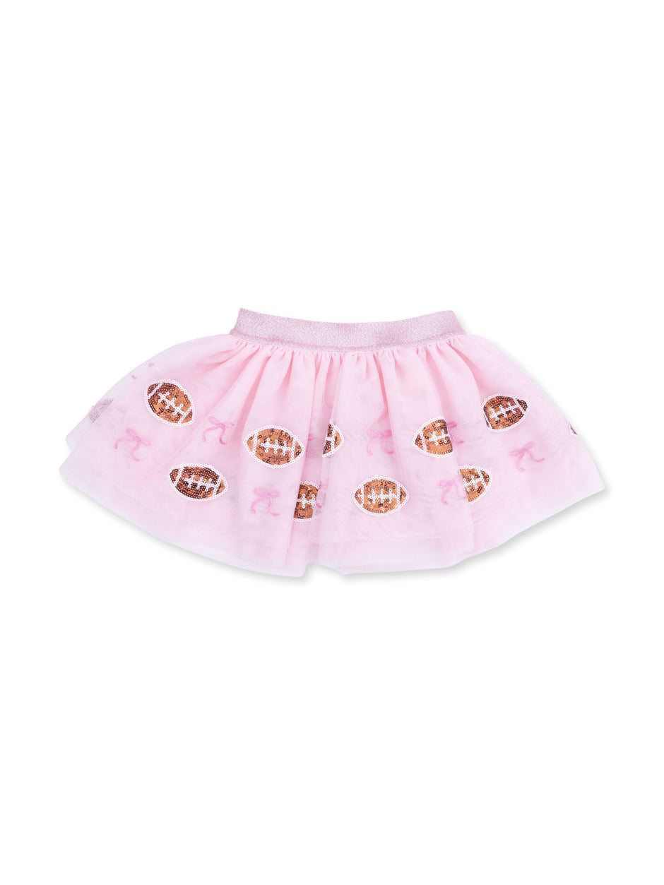 Pink tutu skirt with football and ribbon patterns, ideal for playful and sporty occasions.