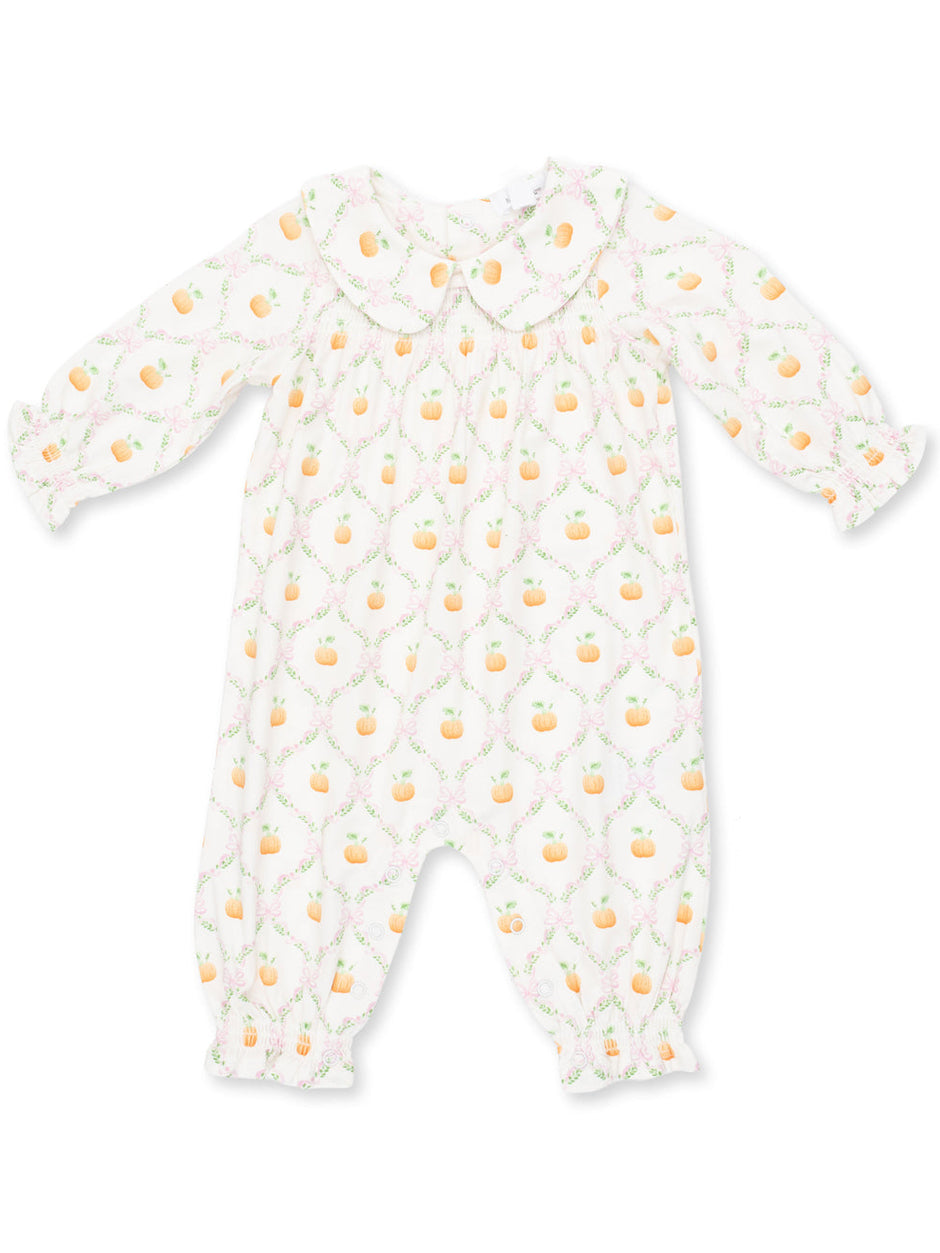 Baby romper with a subtle pumpkin pattern, featuring a collar and gathered sleeves. Perfect for cozy outfits.