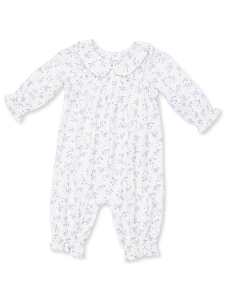 White baby romper with blue floral pattern and Peter Pan collar, featuring long sleeves and elasticized cuffs.