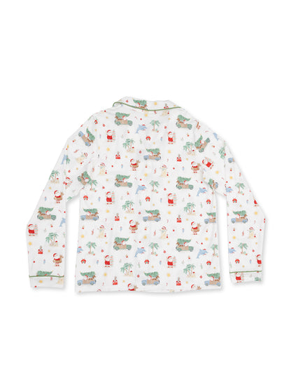 Long-sleeve children's pajama top featuring a playful holiday print with Santa, cars, and tropical motifs.