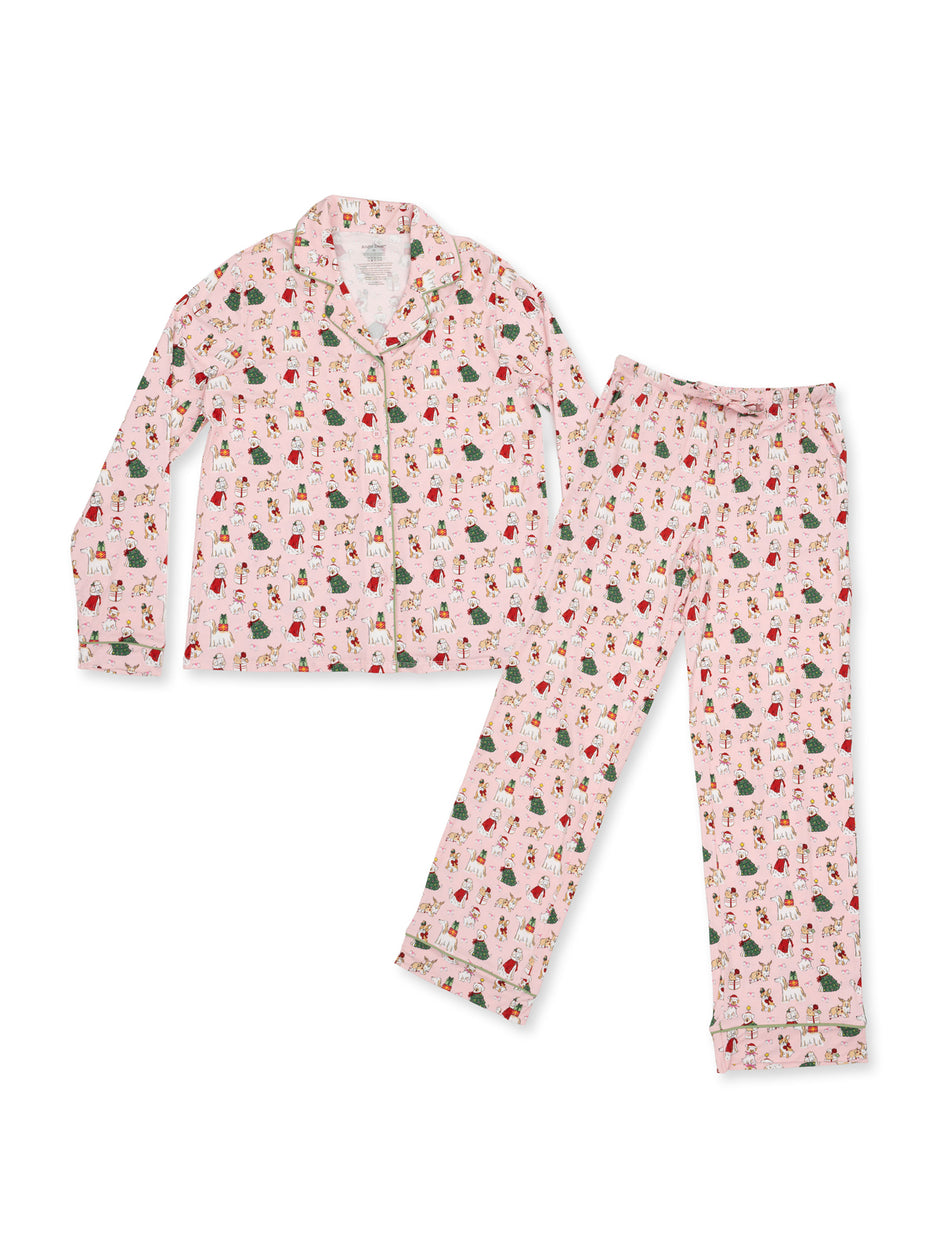 Pink pajama set with holiday-themed prints featuring Santa, trees, and gifts. Includes a button-up top and matching pants.