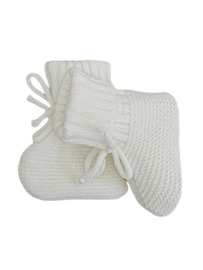 Cozy white knitted baby booties with a textured pattern and tied bows on the cuff.