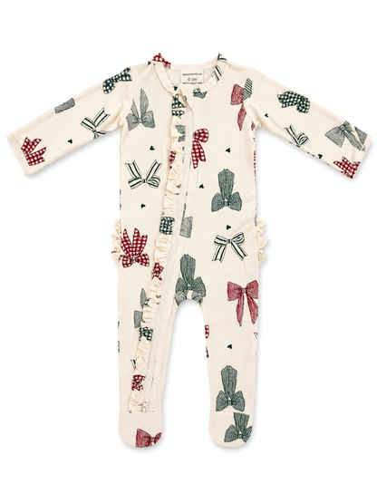 Cream-colored onesie with bow patterns and ruffles, suitable for infants.