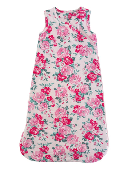 Floral baby sleeping bag in pink and white, featuring a floral pattern with roses and green leaves.