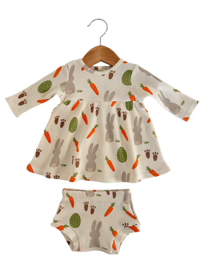 Child's dress and matching bloomers featuring a playful bunny and carrot print on a light background.