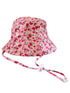 Floral pink bucket hat with a chin strap, featuring small red and green flowers throughout the fabric.