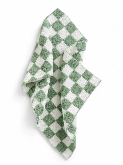 Green and white checkered towel draped, featuring a soft, textured fabric. Ideal for kitchen or bathroom use.