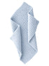 Light blue, textured blanket draped elegantly, showcasing a cozy, woven design.