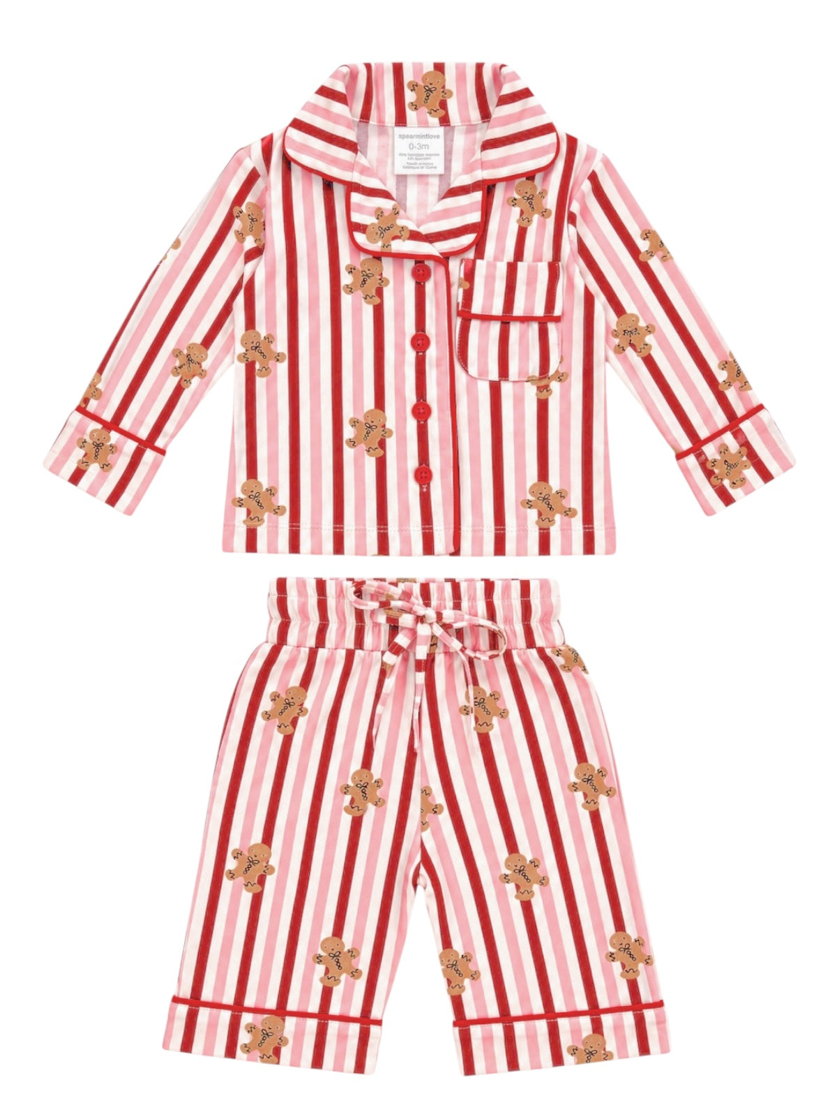 Red and white striped children's pajamas with gingerbread man print. Includes a shirt and shorts.