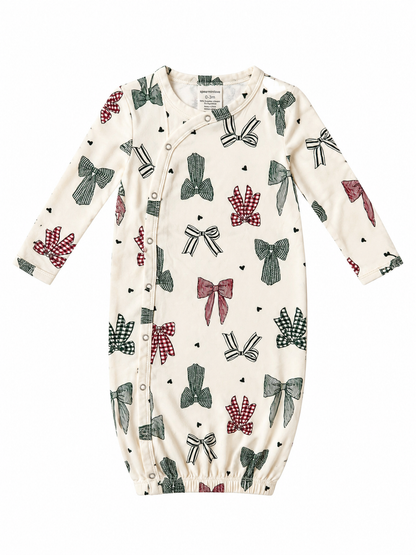 Infant gown featuring a cream background with colorful bow patterns in red, green, and black. Perfect for ages 0-3 months.