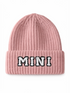Pink knitted beanie with a folded cuff and the word "MINI" in fluffy white letters.