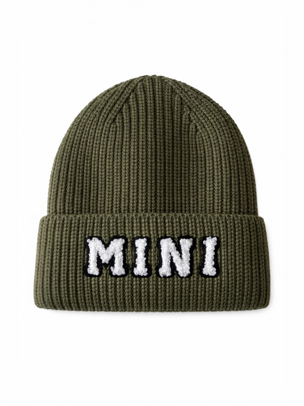 Olive green knit beanie hat with the word "MINI" embroidered on the front.