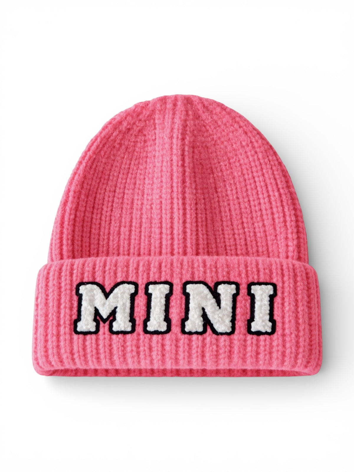 Pink knitted beanie with the word "MINI" embroidered in black and white on the front.