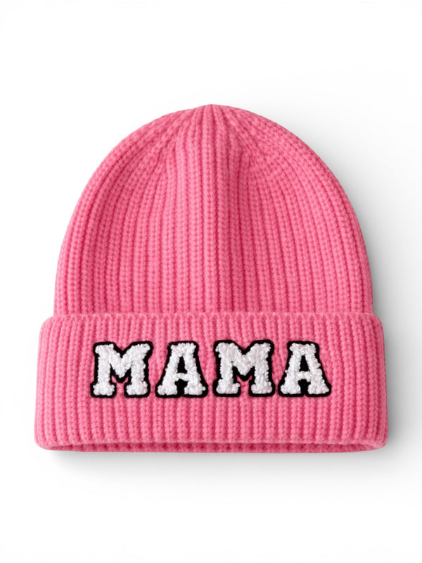 Pink knit beanie with the word "MAMA" in bold, white letters on the front.