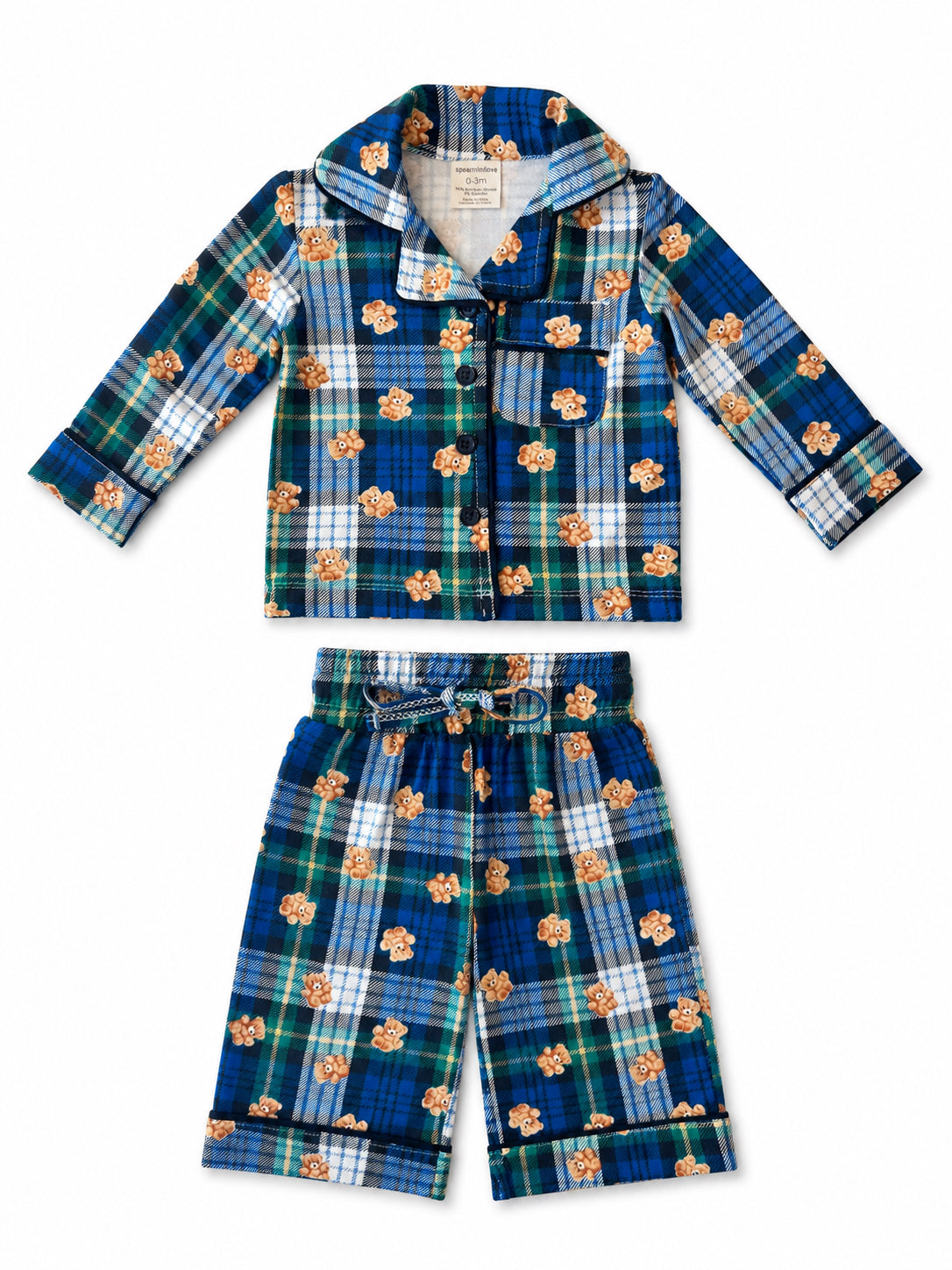 Blue plaid baby pajamas with teddy bear print, featuring long-sleeve top and shorts-style bottoms.