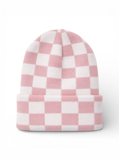 Pink and white checkered beanie hat, folded at the brim, displayed on a white background.