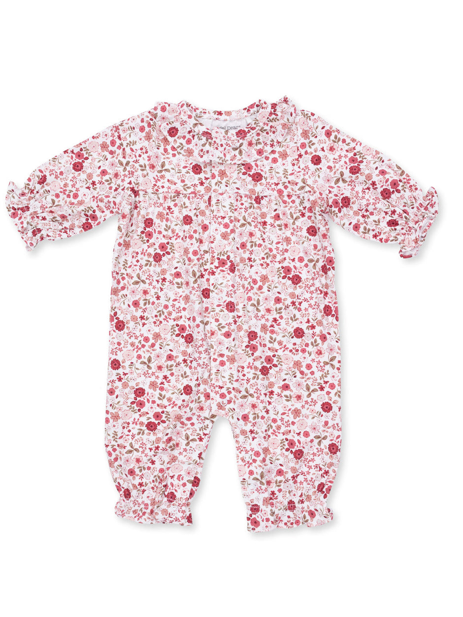 Floral print baby romper in soft pink and white, featuring gathered sleeves and leg openings.