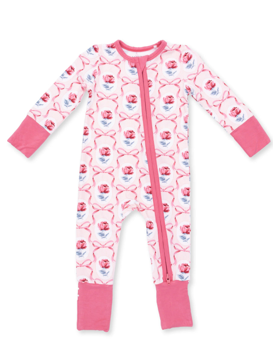 Pink floral baby onesie with long sleeves and a front zipper, featuring rose patterns and pink cuffs.