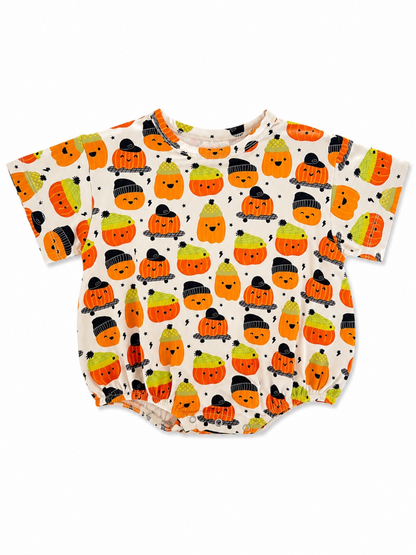 Toddler shirt with colorful pumpkin and ghost pattern on a white background, featuring short sleeves and a round neckline.
