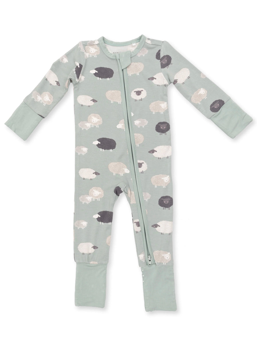 Light green zip-up onesie with sheep print in various colors, featuring long sleeves and footed legs.