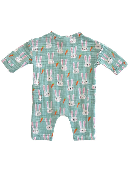 A cute children's romper with a bunny and carrot pattern on a mint green background.