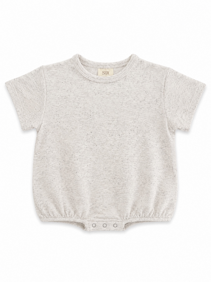Light gray baby t-shirt with short sleeves and snap closure at the bottom, featuring a speckled design.