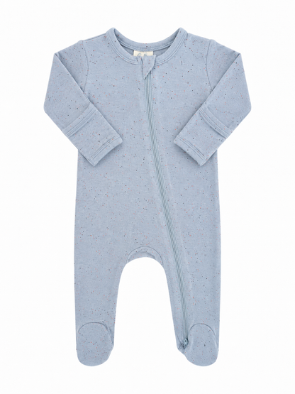 Light blue baby onesie with long sleeves and a front zipper, featuring speckled patterns throughout.