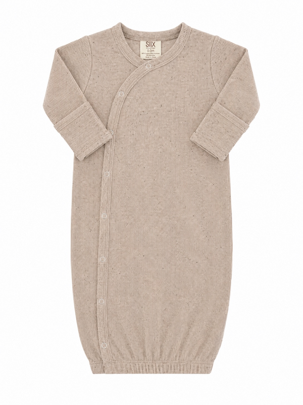Light beige newborn sleep sack with ribbed texture and snap buttons, designed for comfort and ease of use.