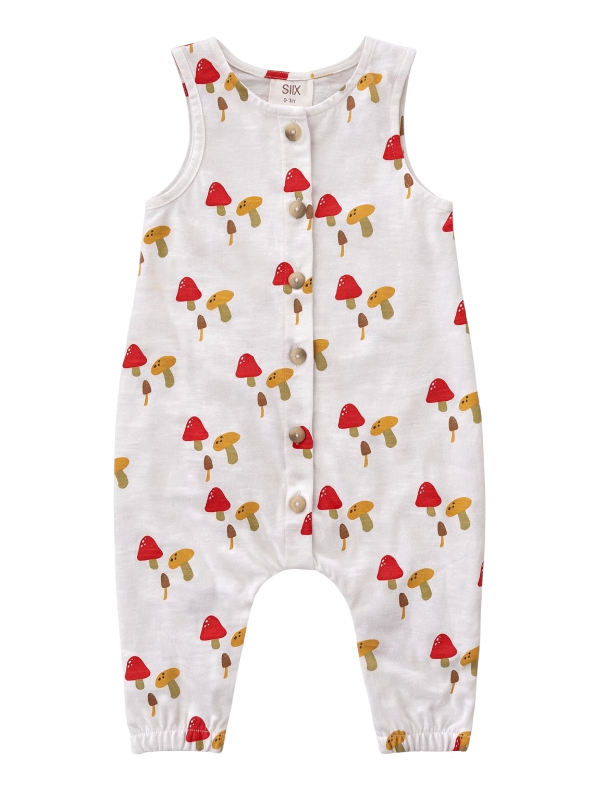 White baby romper with mushroom print, featuring red and brown mushrooms and buttons down the front.