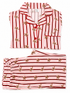 Red and pink striped women's pajamas with gingerbread cookie print, neatly folded.