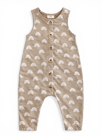 Tan romper with white rainbow patterns and wooden buttons, designed for infants.