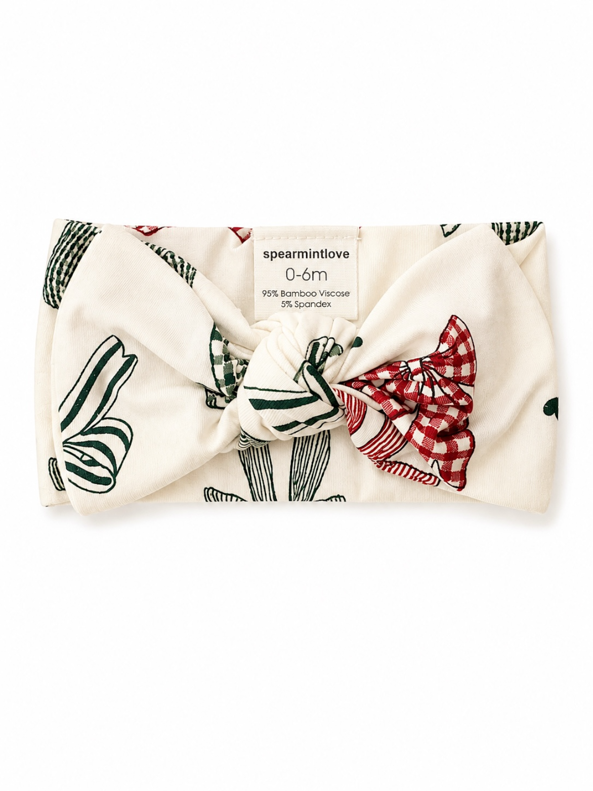 Infant headband with floral patterns in red and green, labeled for ages 0-6 months, made of bamboo and spandex.