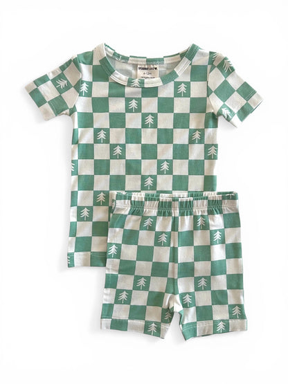 Green and white checkered pajama set featuring trees, includes a short-sleeve shirt and shorts.