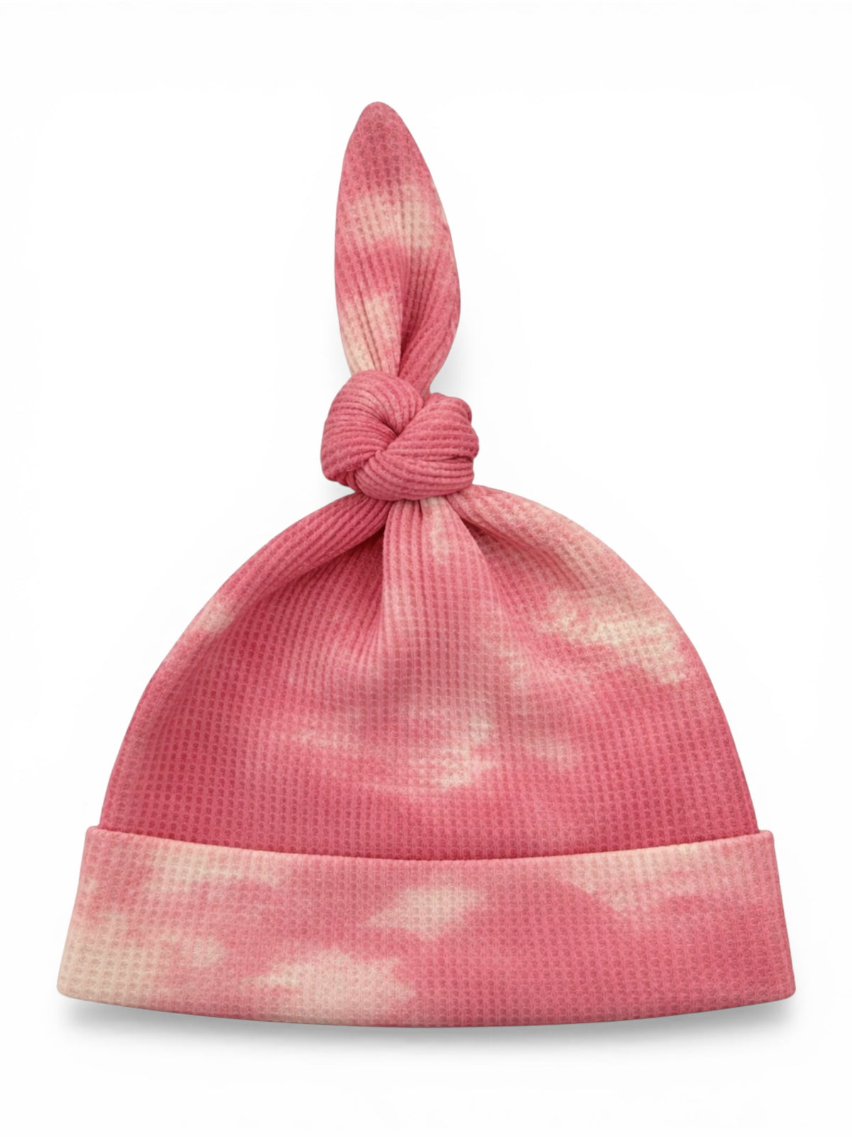 Pink tie-knot beanie with a textured pattern and a soft, cloud-like design.