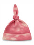 Pink tie-knot beanie with a textured pattern and a soft, cloud-like design.