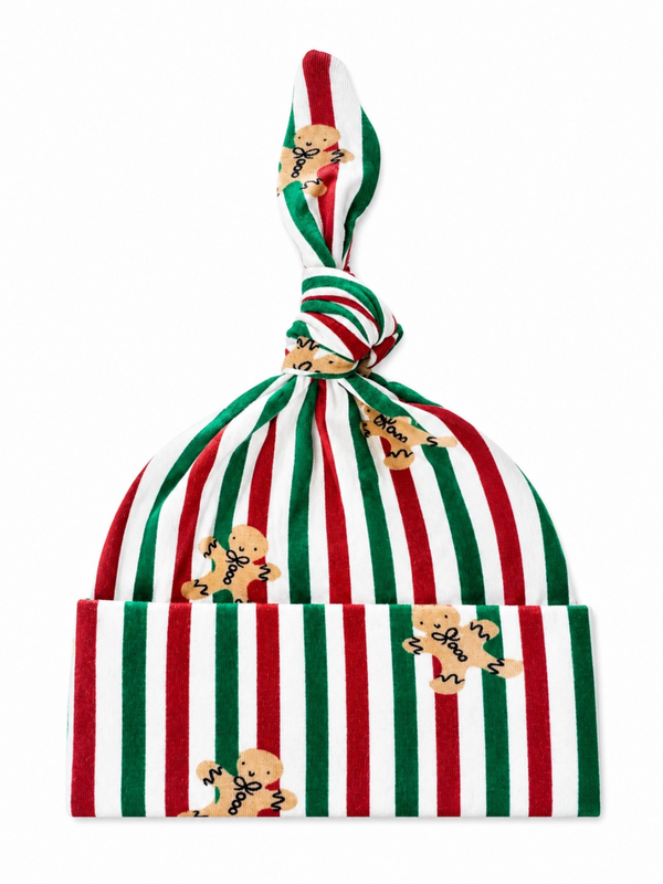 Red and green striped hat with gingerbread man patterns and a knotted top. Ideal for holiday celebrations.
