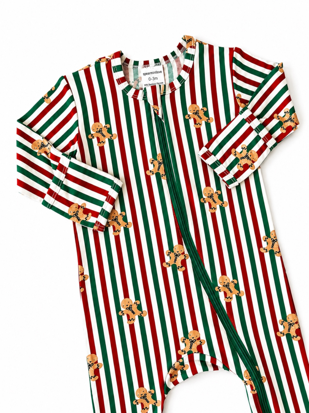 Red and green striped baby onesie with gingerbread cookie prints, featuring a zip closure and long sleeves.