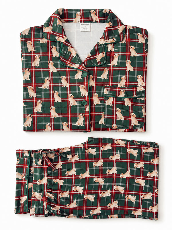 Green plaid pajamas featuring playful golden retriever dog patterns. Perfect for cozy nights.