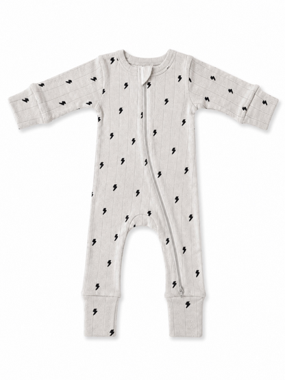 Light gray baby onesie with black lightning bolt patterns and a front zipper. Ideal for comfort and style.